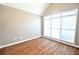 Bright bedroom with hardwood floors and a large window, creating a serene and inviting atmosphere at 811 Ivy Ridge Dr, Loganville, GA 30052