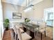Stately dining room featuring modern light fixture, glass dining table and seating for six at 811 Ivy Ridge Dr, Loganville, GA 30052