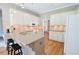 Well-lit kitchen with modern appliances, granite countertops, and hardwood floors at 811 Ivy Ridge Dr, Loganville, GA 30052