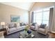 Inviting living room features stylish furnishings, natural light, and a calming atmosphere at 811 Ivy Ridge Dr, Loganville, GA 30052
