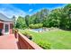 Back deck leads to a sprawling green backyard with a gorgeous blue swimming pool at 811 Ivy Ridge Dr, Loganville, GA 30052