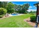 A backyard featuring a well-manicured lawn and refreshing pool, great for outdoor enjoyment at 811 Ivy Ridge Dr, Loganville, GA 30052