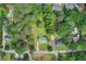 Aerial view of a home with lush greenery, a metal roof, and a well-maintained yard at 173 Elder Dr, Social Circle, GA 30025