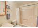 Bathroom featuring a shower, a sink, and a toilet, with neutral paint color at 173 Elder Dr, Social Circle, GA 30025