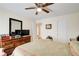 Inviting bedroom featuring neutral walls, carpet flooring, wooden furniture, and great natural light at 173 Elder Dr, Social Circle, GA 30025
