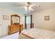 Bedroom featuring hardwood furniture, and a ceiling fan, creating a serene retreat at 173 Elder Dr, Social Circle, GA 30025
