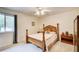 Bedroom with natural light, a ceiling fan, a wooden bed frame, and carpeted floors at 173 Elder Dr, Social Circle, GA 30025