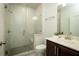 Modern bathroom with glass-enclosed shower and vanity with white countertop at 323 Concord St, Alpharetta, GA 30009