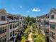 Serene view of the community's landscaping, sidewalks and charming architecture at 323 Concord St, Alpharetta, GA 30009