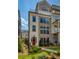 Beautiful multi-story townhome featuring a brick facade and a vibrant red front door at 323 Concord St, Alpharetta, GA 30009