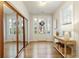 Elegant foyer with hardwood floors, mirrored doors, and lots of natural light at 323 Concord St, Alpharetta, GA 30009