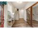 Bright foyer with hardwood floors, staircase, and mirrored closet doors at 323 Concord St, Alpharetta, GA 30009