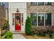 Inviting red front door with wreath and a decorative welcome mat at 323 Concord St, Alpharetta, GA 30009
