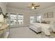 Spacious main bedroom featuring neutral tones, large windows, and stylish furnishings at 323 Concord St, Alpharetta, GA 30009