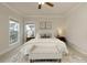 Bright main bedroom featuring neutral tones, large windows, and stylish furnishings at 323 Concord St, Alpharetta, GA 30009