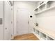 Neat mudroom with built-in bench and storage, provides an organized transition space from outside to home at 323 Concord St, Alpharetta, GA 30009