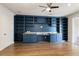 Home office with custom shelving, granite countertops, and hardwood floors at 323 Concord St, Alpharetta, GA 30009