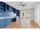 Spacious home office with custom shelves and drawers and a sliding glass door to a balcony at 323 Concord St, Alpharetta, GA 30009
