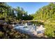 Scenic pond area with a lovely overlook and seating, surrounded by lush greenery at 323 Concord St, Alpharetta, GA 30009