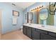 Bathroom featuring updated double sinks, creative back splash, and linen closet at 5245 Olde Mill Rd, Woodstock, GA 30188