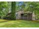 Charming home with stone accents, inviting porch, and lush greenery at 5245 Olde Mill Rd, Woodstock, GA 30188