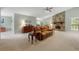 Open living room with stone fireplace, comfortable seating, and neutral carpeting at 5245 Olde Mill Rd, Woodstock, GA 30188
