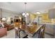An open-concept floor plan featuring a living space, dining area, and kitchen at 5245 Olde Mill Rd, Woodstock, GA 30188