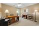 Home office space with carpeted floors, natural light, and a desk for comfortable working at 5245 Olde Mill Rd, Woodstock, GA 30188