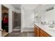Bathroom with soaking tub, a shower, and double vanity with wood cabinets at 6213 Indian Wood Cir, Mableton, GA 30126