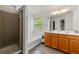 Bathroom with dual vanity, soaking tub, and walk-in shower at 6213 Indian Wood Cir, Mableton, GA 30126