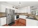 Eat in kitchen featuring stainless appliances, granite counter tops and white cabinets at 6213 Indian Wood Cir, Mableton, GA 30126