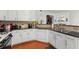 Well-lit kitchen featuring granite countertops, white cabinets, and stainless steel appliances at 6213 Indian Wood Cir, Mableton, GA 30126