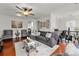 Open-concept living room featuring a modern ceiling fan and stylish decor at 6213 Indian Wood Cir, Mableton, GA 30126