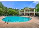 Inviting community pool surrounded by comfortable lounge chairs and lush greenery at 6213 Indian Wood Cir, Mableton, GA 30126