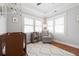 Bedroom featuring hardwood floors, a crib, and comfortable sitting chair at 630 John Wesley Dobbs Ne Ave, Atlanta, GA 30312