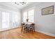 Cozy dining area featuring hardwood floors, white trim and a table setting with flowers at 630 John Wesley Dobbs Ne Ave, Atlanta, GA 30312