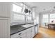 Bright kitchen with granite countertops, stainless steel appliances, and hanging pot rack at 630 John Wesley Dobbs Ne Ave, Atlanta, GA 30312