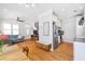 Open-concept living room with hardwood floors, view of kitchen, and bright natural light at 630 John Wesley Dobbs Ne Ave, Atlanta, GA 30312