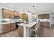 Contemporary kitchen features a spacious island with seating, ample cabinet space and stainless appliances at 707 Mirror Lake Parkway Way, Villa Rica, GA 30180