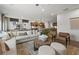Open concept living area with stylish furnishings that connect to the kitchen at 707 Mirror Lake Parkway Way, Villa Rica, GA 30180