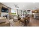 Spacious living room with fireplace, large windows, and contemporary furniture at 707 Mirror Lake Parkway Way, Villa Rica, GA 30180