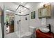 Modern bathroom with tiled shower, glass door and updated vanity at 7550 Fielder Rd, Jonesboro, GA 30236