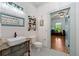 Stylish bathroom with a custom vanity, vessel sink, and black and white tiled floors at 7550 Fielder Rd, Jonesboro, GA 30236