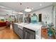 Open concept kitchen with island, stainless steel appliances and view to dining area at 7550 Fielder Rd, Jonesboro, GA 30236