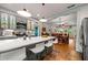 Open concept kitchen with island, stainless steel appliances and view to dining area at 7550 Fielder Rd, Jonesboro, GA 30236