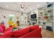 Bright living room features shiplap walls, built-in shelving, and a cozy fireplace at 7550 Fielder Rd, Jonesboro, GA 30236