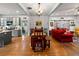 Open-concept space with living room, dining area, and kitchen featuring hardwood floors at 7550 Fielder Rd, Jonesboro, GA 30236