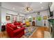 Cozy living room with hardwood floors, a fireplace, and stylish décor, filled with natural light at 7550 Fielder Rd, Jonesboro, GA 30236