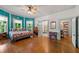 Spacious main bedroom with large windows, hardwood floors and ensuite bathroom at 7550 Fielder Rd, Jonesboro, GA 30236
