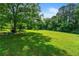 Green lawn with large trees at 7550 Fielder Rd, Jonesboro, GA 30236